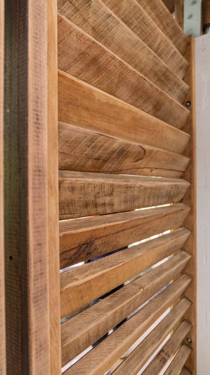 Close-up of an angled wooden slat wall or partition, showcasing the texture and grain of the wood, part of the Lookout Project at Wentworth Falls.